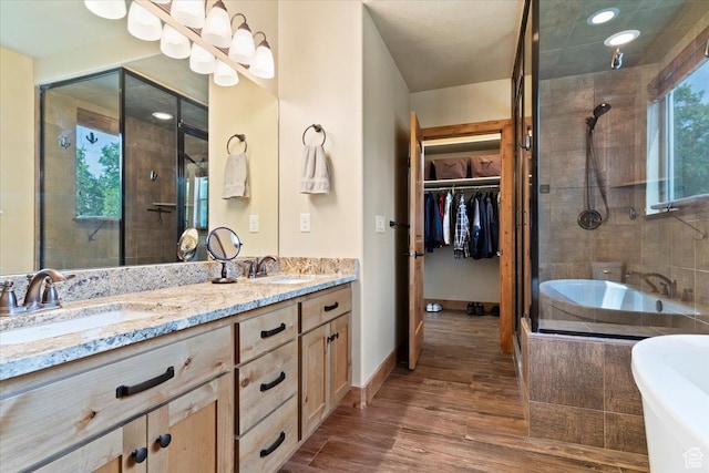 145 N 10450 E, Huntsville, UT 84317 - full bathroom with a shower stall, double vanity, a garden tub, wood finished floors, and recessed lighting