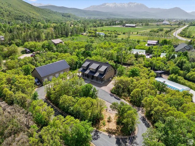 145 N 10450 E, Huntsville, UT 84317 - aerial view of a mountainous background and a heavily wooded area