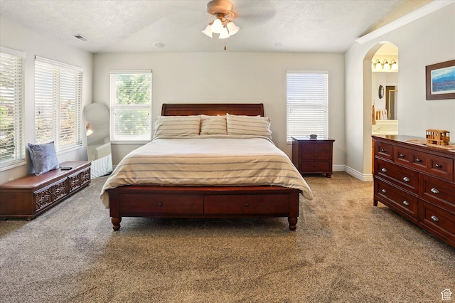 1926 N 1420 W, Provo, UT 84604 - bedroom with light colored carpet, arched walkways, baseboards, ensuite bathroom, and ceiling fan