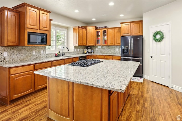 1926 N 1420 W, Provo, UT 84604 - kitchen with fridge with ice dispenser, built in microwave, wood finished floors, a sink, and light stone countertops