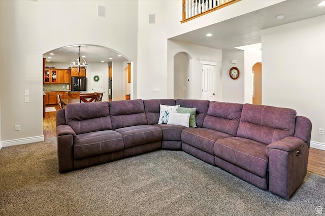 1926 N 1420 W, Provo, UT 84604 - living room with a towering ceiling, arched walkways, recessed lighting, a chandelier, and baseboards