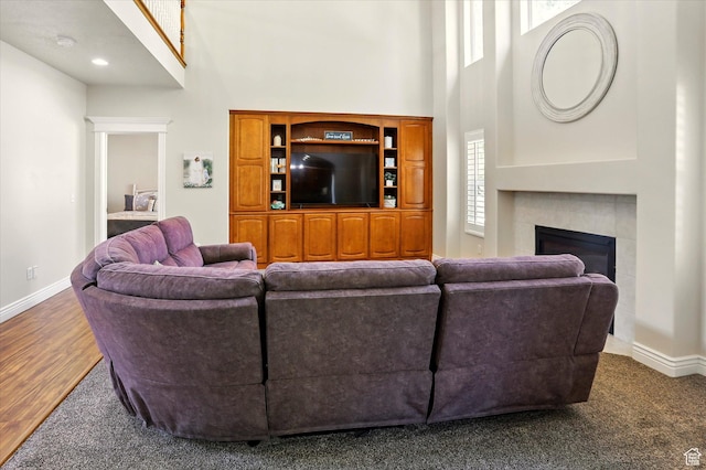 1926 N 1420 W, Provo, UT 84604 - living room featuring a high ceiling, baseboards, a tiled fireplace, and wood finished floors