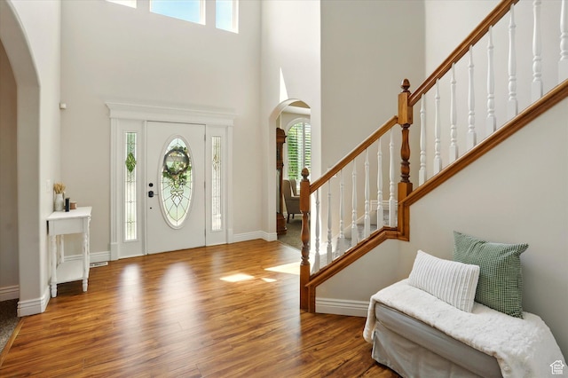 1926 N 1420 W, Provo, UT 84604 - entrance foyer featuring arched walkways, healthy amount of natural light, wood finished floors, a towering ceiling, and baseboards
