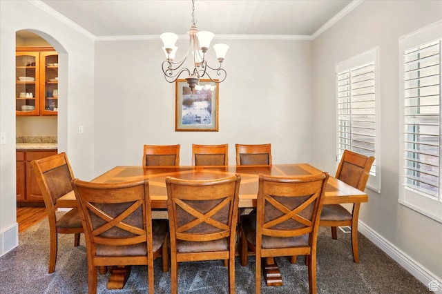 1926 N 1420 W, Provo, UT 84604 - dining area featuring carpet floors, a chandelier, ornamental molding, arched walkways, and baseboards