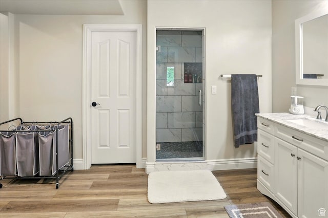 1926 N 1420 W, Provo, UT 84604 - bathroom featuring vanity, a shower stall, baseboards, and wood finished floors