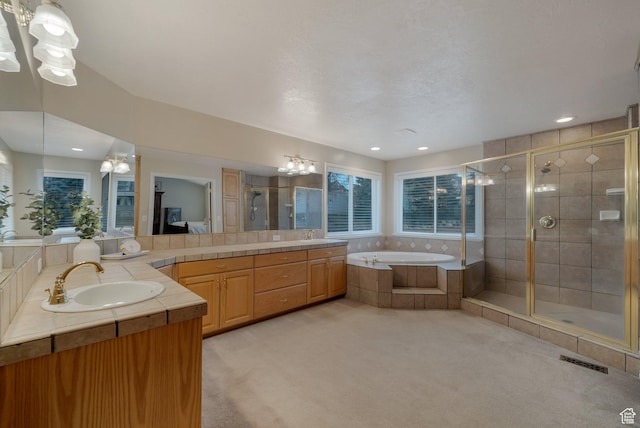 6192 W Ridge Rd, Highland, UT 84003 - full bathroom featuring a shower stall, two vanities, a garden tub, a chandelier, and recessed lighting