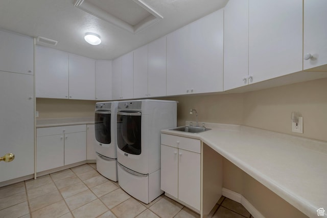 6192 W Ridge Rd, Highland, UT 84003 - laundry area with washing machine and dryer, cabinet space, and light tile patterned floors
