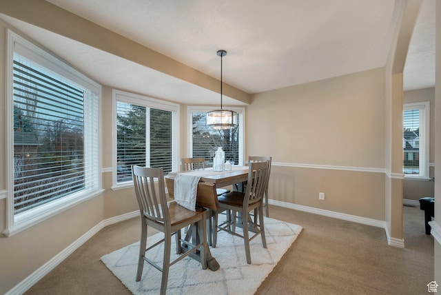6192 W Ridge Rd, Highland, UT 84003 - carpeted dining space with healthy amount of natural light, baseboards, and a chandelier