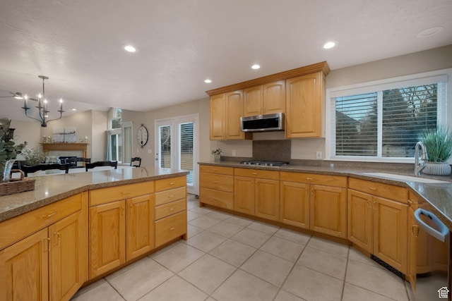 6192 W Ridge Rd, Highland, UT 84003 - kitchen with appliances with stainless steel finishes, a sink, light tile patterned flooring, recessed lighting, and a chandelier