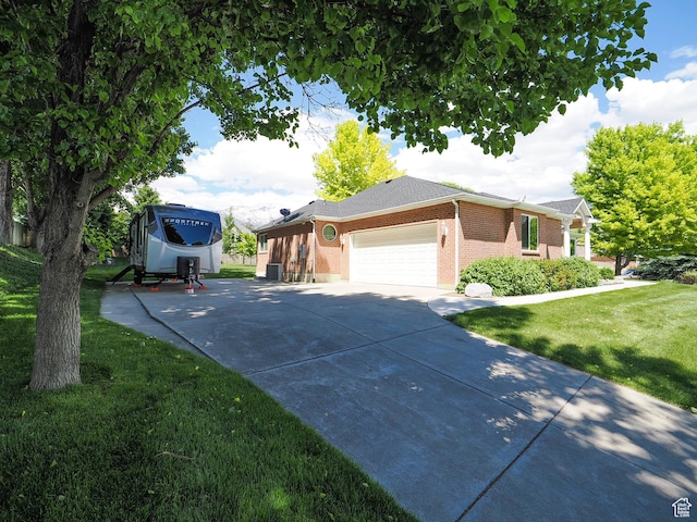 6192 W Ridge Rd, Highland, UT 84003 - view of side of home with a lawn, a garage, driveway, brick siding, and cooling unit