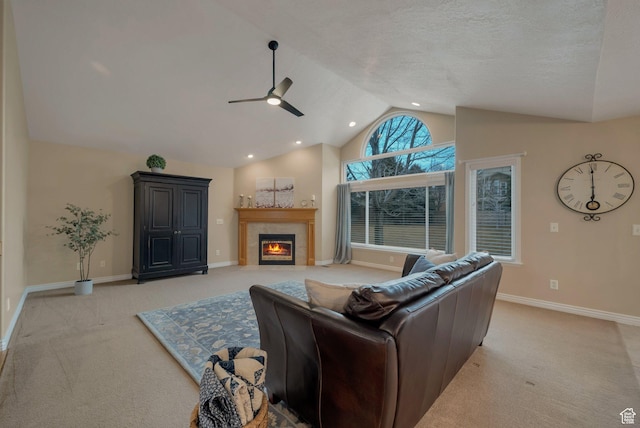 6192 W Ridge Rd, Highland, UT 84003 - living room with light colored carpet, ceiling fan, vaulted ceiling, a tile fireplace, and baseboards