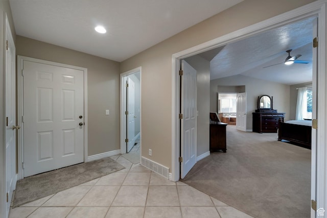 6192 W Ridge Rd, Highland, UT 84003 - entryway with baseboards, ceiling fan, light carpet, light tile patterned floors, and lofted ceiling