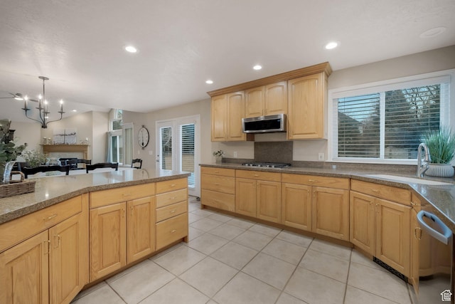6192 W Ridge Rd, Highland, UT 84003 - kitchen with stainless steel appliances, a sink, light brown cabinetry, healthy amount of natural light, and recessed lighting