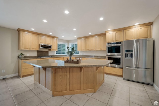 6192 W Ridge Rd, Highland, UT 84003 - kitchen with stainless steel appliances, light brown cabinetry, a center island, recessed lighting, and dark stone countertops