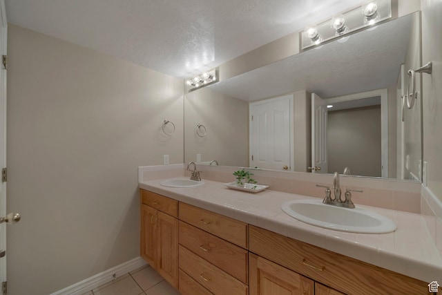 6192 W Ridge Rd, Highland, UT 84003 - bathroom with tile patterned flooring, double vanity, and baseboards
