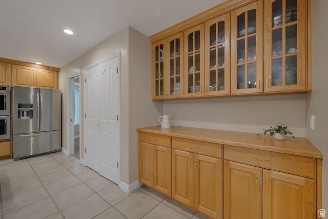 6192 W Ridge Rd, Highland, UT 84003 - kitchen with stainless steel appliances, light tile patterned flooring, light countertops, glass insert cabinets, and recessed lighting