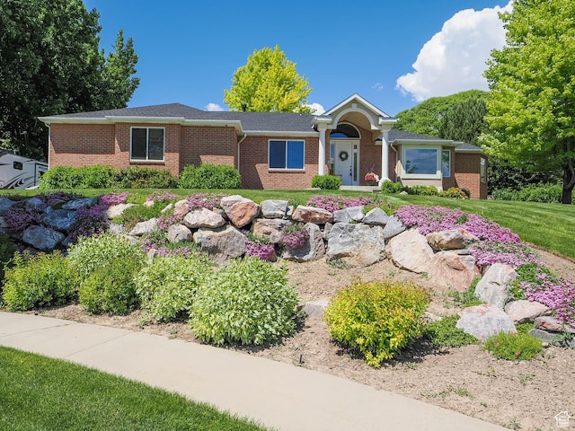 6192 W Ridge Rd, Highland, UT 84003 - ranch-style home with brick siding and a front lawn