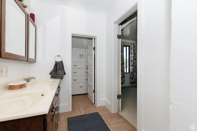 77 N 1st W, Preston, ID 83263 - full bathroom with double vanity, tile patterned floors, and baseboards