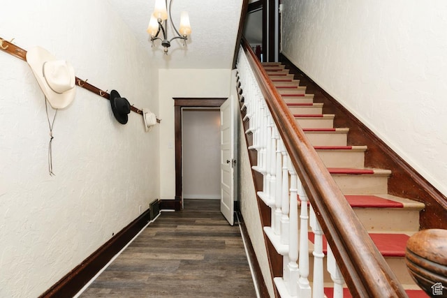 77 N 1st W, Preston, ID 83263 - stairway with a chandelier, wood finished floors, and a textured wall