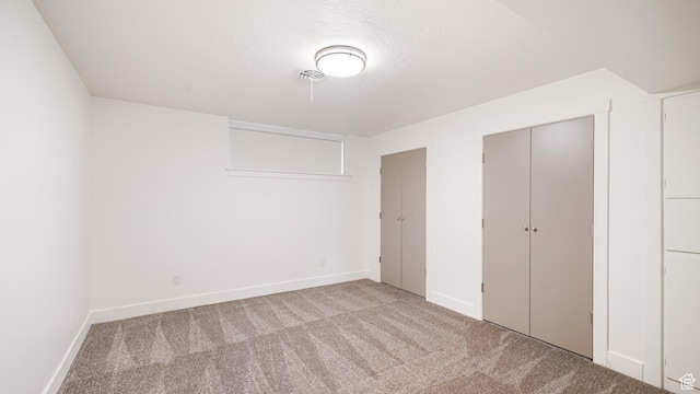 2820 E Wanda Way S, Salt Lake City, UT 84117 - unfurnished bedroom with carpet flooring, baseboards, and a textured ceiling