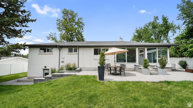 2820 E Wanda Way S, Salt Lake City, UT 84117 - rear view of property featuring a patio, a chimney, brick siding, and a sunroom