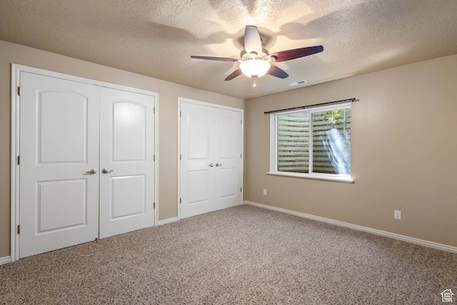 1111 E Bench View Dr, Ogden, UT 84404 - unfurnished bedroom featuring a textured ceiling, carpet, baseboards, and a ceiling fan