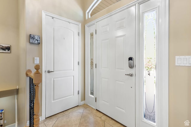 1111 E Bench View Dr, Ogden, UT 84404 - foyer featuring light tile patterned floors and baseboards