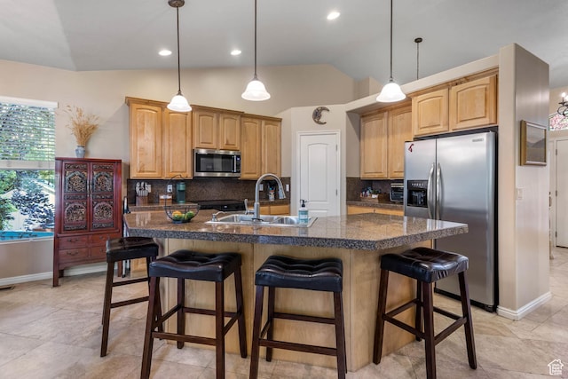1111 E Bench View Dr, Ogden, UT 84404 - kitchen with stainless steel appliances, dark countertops, a sink, decorative backsplash, and lofted ceiling