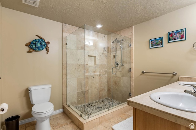1111 E Bench View Dr, Ogden, UT 84404 - bathroom with a shower stall, toilet, a textured ceiling, vanity, and tile patterned flooring