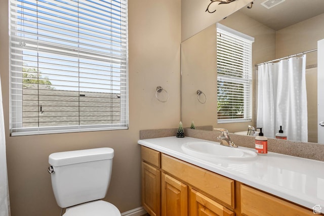 1111 E Bench View Dr, Ogden, UT 84404 - bathroom with vanity, toilet, and a shower with shower curtain