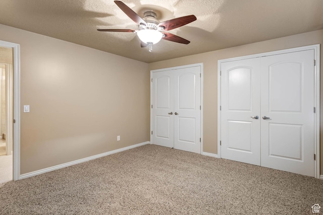 1111 E Bench View Dr, Ogden, UT 84404 - unfurnished bedroom with carpet flooring, baseboards, a ceiling fan, a textured ceiling, and a closet