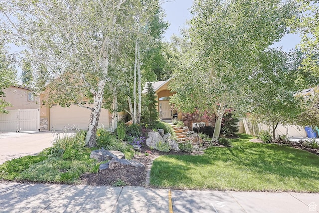 1111 E Bench View Dr, Ogden, UT 84404 - obstructed view of property with concrete driveway, stucco siding, and a garage