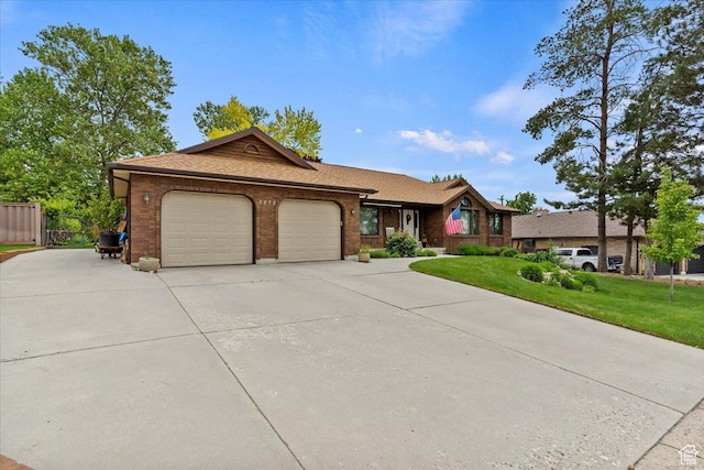 3272 N 175 W, North Ogden, UT 84414 - single story home featuring an attached garage, concrete driveway, brick siding, and a shingled roof