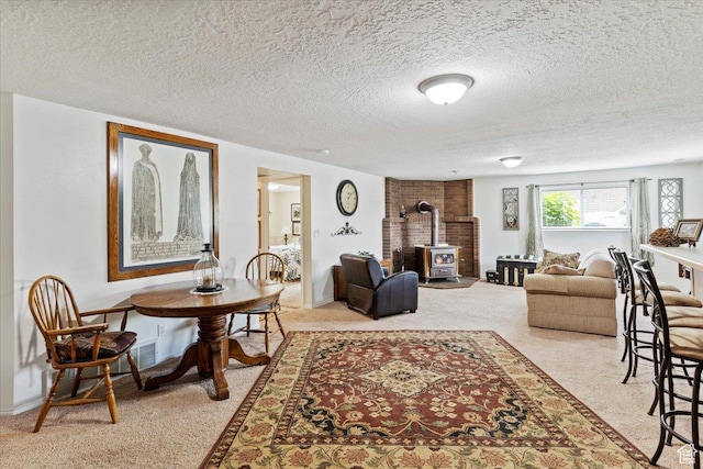 3272 N 175 W, North Ogden, UT 84414 - carpeted living room featuring a wood stove and a textured ceiling