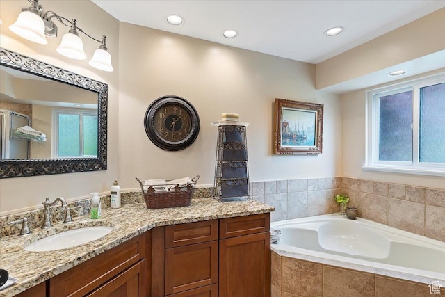 3272 N 175 W, North Ogden, UT 84414 - bathroom with healthy amount of natural light, a bath, vanity, a shower with shower door, and recessed lighting