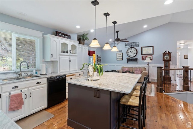 3272 N 175 W, North Ogden, UT 84414 - kitchen featuring dishwasher, a sink, a center island, a ceiling fan, and a breakfast bar