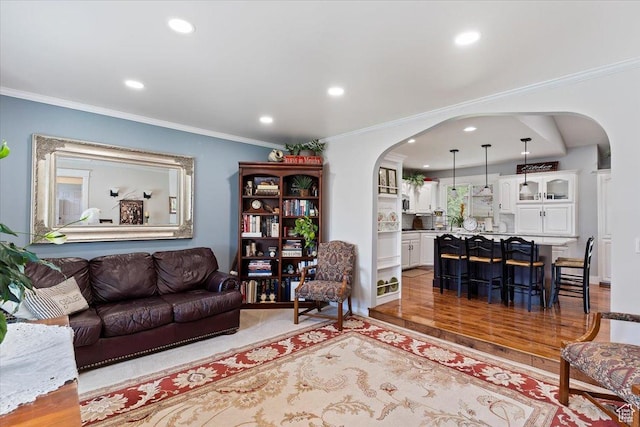 3272 N 175 W, North Ogden, UT 84414 - living area featuring arched walkways, recessed lighting, ornamental molding, and light wood-type flooring
