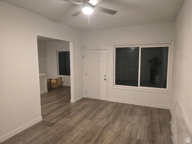 530 E 31st St, Ogden, UT 84403 - spare room with dark wood-style flooring, a ceiling fan, baseboards, and a textured ceiling