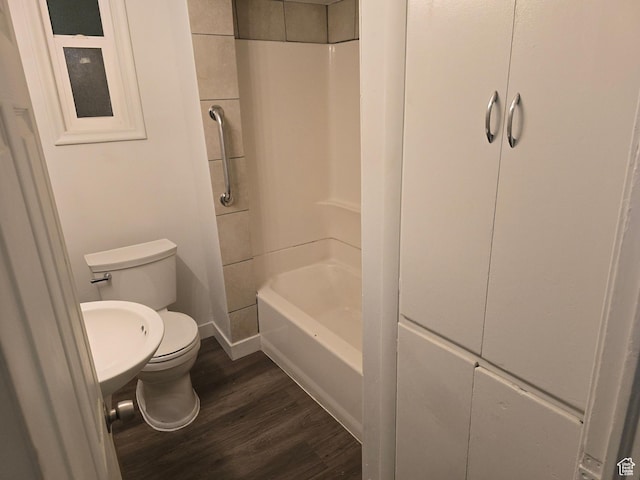 530 E 31st St, Ogden, UT 84403 - full bathroom with toilet, wood finished floors, washtub / shower combination, and baseboards