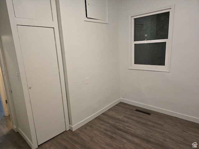 530 E 31st St, Ogden, UT 84403 - unfurnished bedroom featuring dark wood-type flooring and baseboards