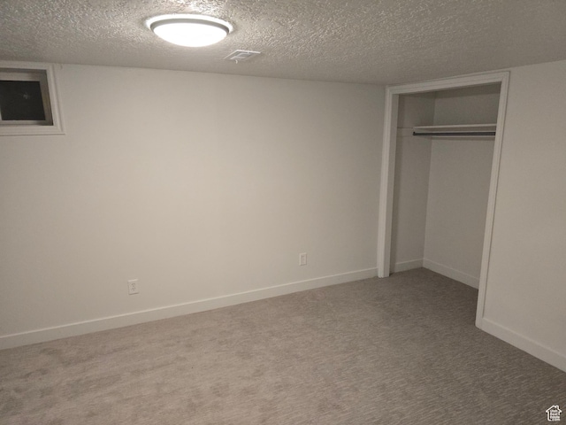 530 E 31st St, Ogden, UT 84403 - unfurnished bedroom featuring a textured ceiling, carpet floors, a closet, and baseboards