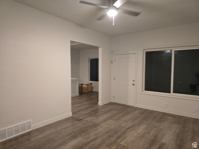 530 E 31st St, Ogden, UT 84403 - spare room featuring dark wood-style flooring, a ceiling fan, and baseboards