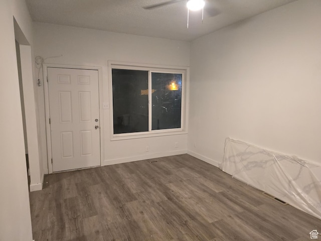 530 E 31st St, Ogden, UT 84403 - spare room featuring dark wood-style flooring, ceiling fan, and baseboards