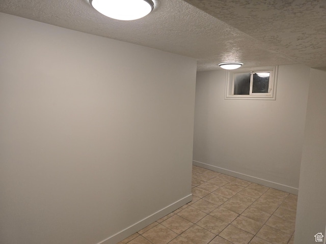 530 E 31st St, Ogden, UT 84403 - finished basement with a textured ceiling, baseboards, and light tile patterned flooring