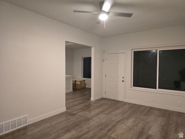 530 E 31st St, Ogden, UT 84403 - spare room featuring dark wood-style flooring, ceiling fan, baseboards, and a textured ceiling