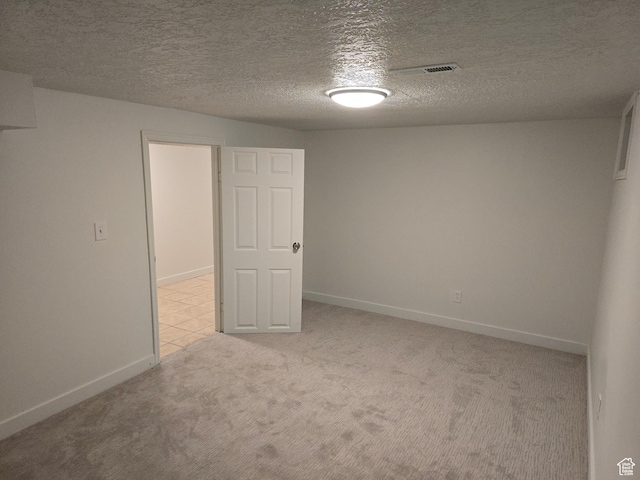 530 E 31st St, Ogden, UT 84403 - empty room featuring light colored carpet, baseboards, and a textured ceiling