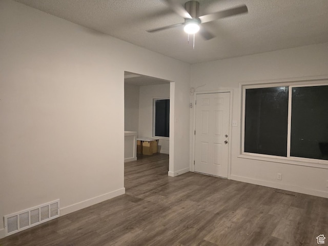 530 E 31st St, Ogden, UT 84403 - spare room featuring ceiling fan, dark wood-type flooring, a textured ceiling, and baseboards