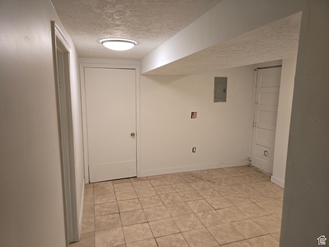 530 E 31st St, Ogden, UT 84403 - finished below grade area with a textured ceiling, electric panel, and light tile patterned floors