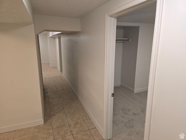 530 E 31st St, Ogden, UT 84403 - hall featuring light tile patterned flooring, baseboards, and a textured ceiling