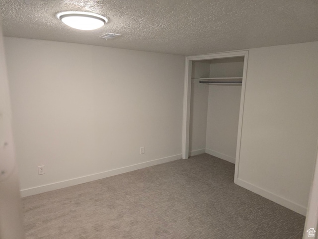 530 E 31st St, Ogden, UT 84403 - unfurnished bedroom with a textured ceiling, carpet, a closet, and baseboards